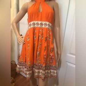 Adorable cotton sundress, orange with floral pattern.  Size large, fits (6-10)